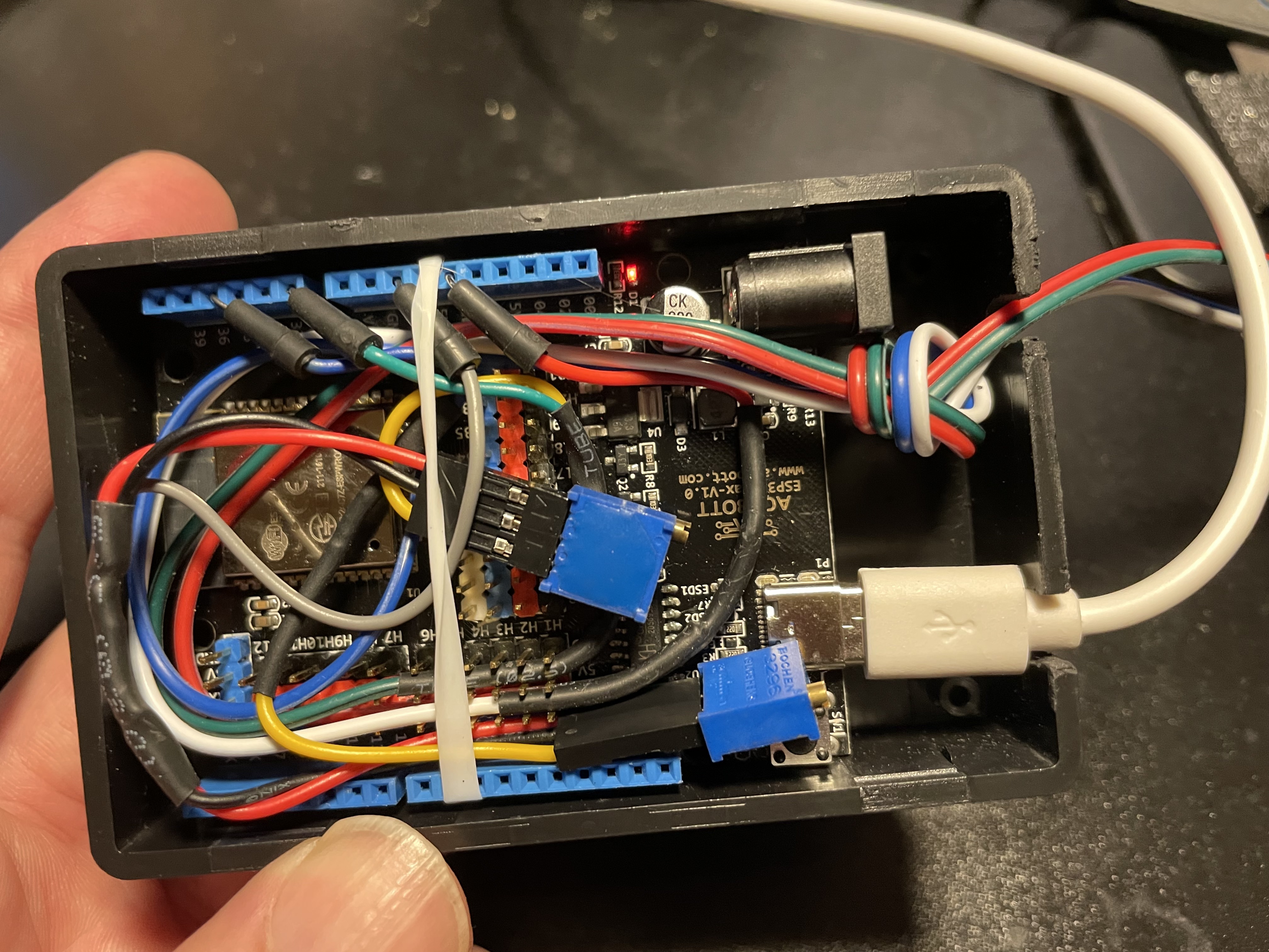 Interior of bed sensor case showing wiring for ESP32 sensor.